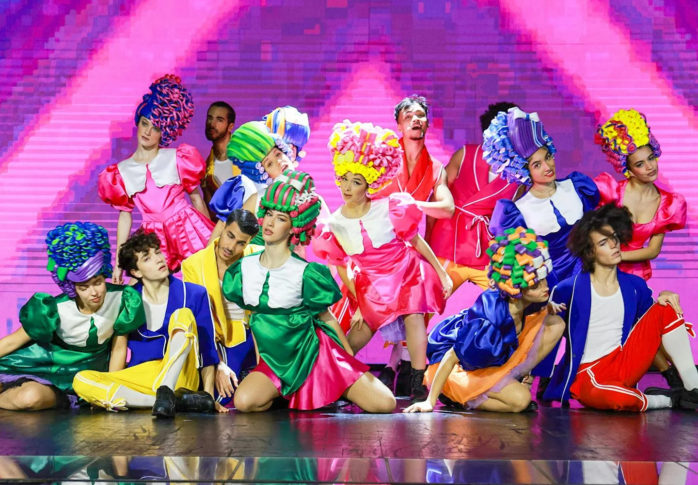 Colourfully dressed performers in Mon Premier Cabaret
